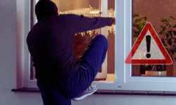 zdjęcie kolorowe grafiki jak mężczyzna wchodzi do pomieszczenia przez okno obok znak ostrzegawczy